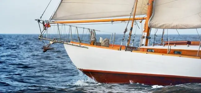 A traditional sailing yacht showing antifoul applied below the waterline